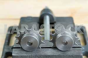 Different construction tools on a wooden background - screwdriver, caliper.