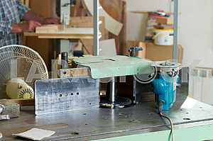 Carpenter tools on wooden table with sawdust. Circular Saw. Carpenter workplace top view