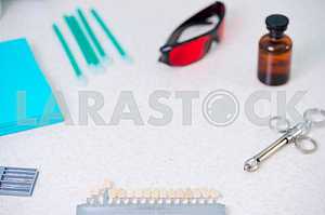 Stomatological instrument in the dentists clinic. Operation, tooth replacement.