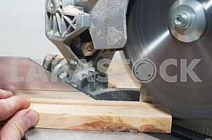 Carpenter tools on wooden table with sawdust. Circular Saw.