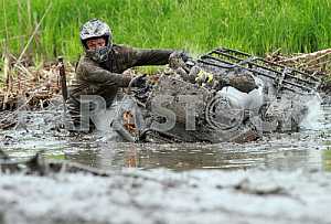 The athlete runs the distance in the competition ATV on hard enduro July 27, 2013
