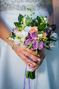 Wedding Bouquet with hands on it, rings