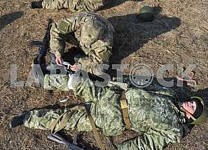 Medical instructor assists the fighter