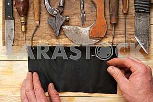 Carpenter tools on wooden table with sawdust. Circular Saw.
