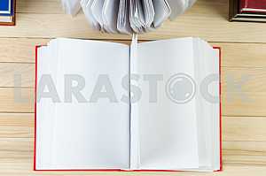 Stack of hardback books on wooden table. Back to school. Copy space