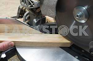 Carpenter tools on wooden table with sawdust. Circular Saw.