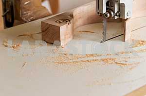Carpenter tools on wooden table with sawdust. Circular Saw. Carpenter workplace top view