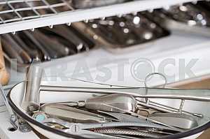 Stomatological instrument in the dentists clinic. Operation, tooth replacement.