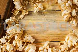 Carpenter tools on wooden table with sawdust. Circular Saw.