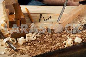 Carpenter tools on wooden table with sawdust. Circular Saw.