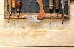 Carpenter tools on wooden table with sawdust. Circular Saw.