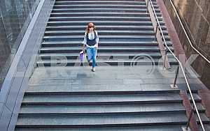 Girl on the stairs of the underpass