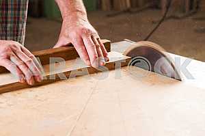Carpenter tools on wooden table with sawdust. Circular Saw. Carpenter workplace top view