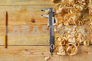 Carpenter tools on wooden table with sawdust. Circular Saw.