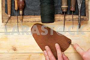Carpenter tools on wooden table with sawdust. Circular Saw.