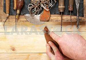 Carpenter tools on wooden table with sawdust. Circular Saw.