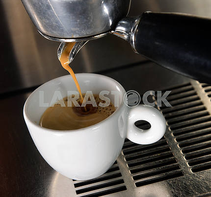 Espresso pouring into a cup