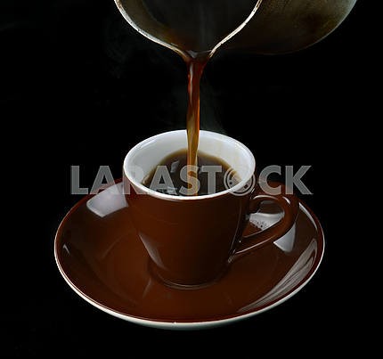 Pouring coffee in a cup