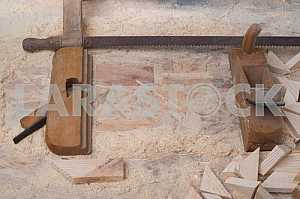 Different construction tools on a wooden background - screwdriver, caliper.