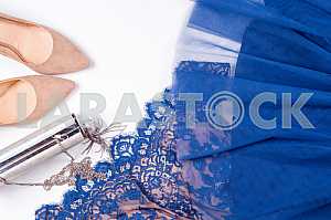Woman clothes and accessories. Soft blue colors female apparel.