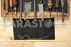 Carpenter tools on wooden table with sawdust. Circular Saw.