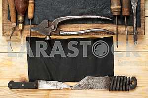 Carpenter tools on wooden table with sawdust. Circular Saw.