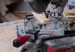 Different construction tools on a wooden background - screwdriver, caliper.