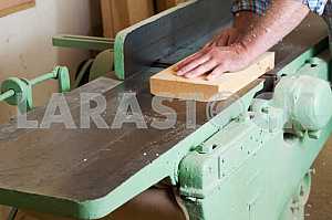 Carpenter tools on wooden table with sawdust. Circular Saw. Carpenter workplace top view