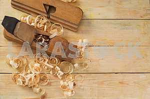 Carpenter tools on wooden table with sawdust. Circular Saw.