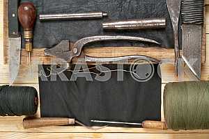 Carpenter tools on wooden table with sawdust. Circular Saw.