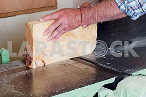 Carpenter tools on wooden table with sawdust. Circular Saw. Carpenter workplace top view