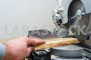Carpenter tools on wooden table with sawdust. Circular Saw.