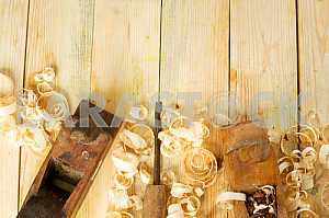 Carpenter tools on wooden table with sawdust. Circular Saw.