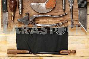 Carpenter tools on wooden table with sawdust. Circular Saw.