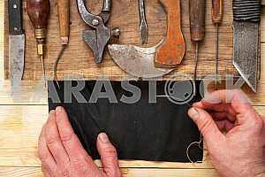 Carpenter tools on wooden table with sawdust. Circular Saw.