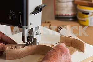 Carpenter tools on wooden table with sawdust. Circular Saw. Carpenter workplace top view
