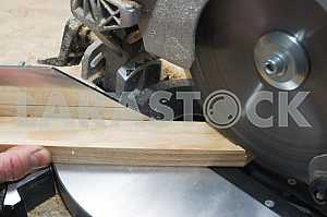 Carpenter tools on wooden table with sawdust. Circular Saw.