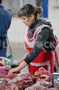 A woman sells meat on the market April 6, 2012