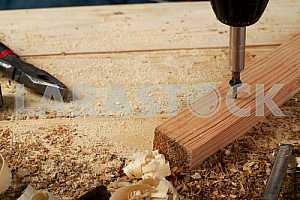 Carpenter tools on wooden table with sawdust. Circular Saw.
