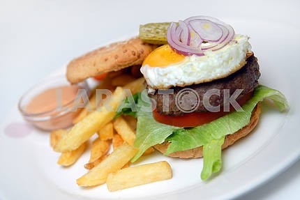 Hamburger with a fried potato
