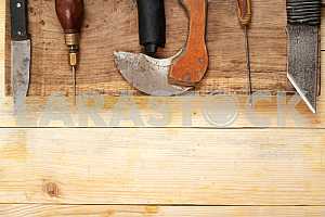 Carpenter tools on wooden table with sawdust. Circular Saw.