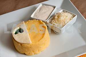 Banush - traditional ukrainian corn dish with cottage cheese and sour cream.