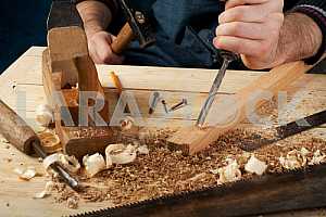 Carpenter tools on wooden table with sawdust. Circular Saw.