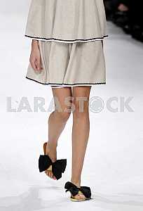 Model shoes with bows demonstrates outfit by Ukrainian designer Larisa Lobanova