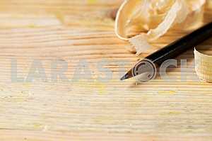 Carpenter tools on wooden table with sawdust. Circular Saw.