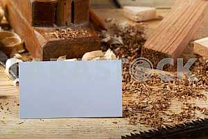 Carpenter tools on wooden table with sawdust. Circular Saw.