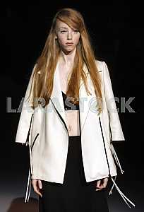 Model in a white jacket attire during a demonstration of Ukrainian designer Katerina KVIT