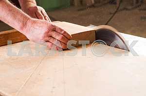 Carpenter tools on wooden table with sawdust. Circular Saw. Carpenter workplace top view