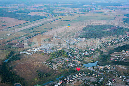 a view from high above - landsacape. little town and the horisont. Balloon flight. basket 1000 meters. having fun, romantic flight