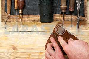 Carpenter tools on wooden table with sawdust. Circular Saw.